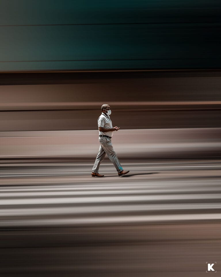 a slow exposure photo of a man walking_living in kigali