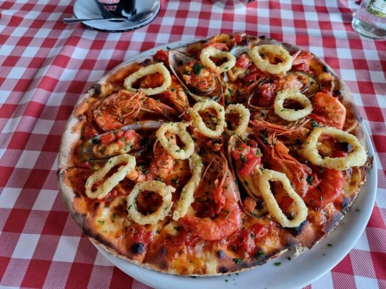 Pizza featuring crawfish and calamari_Living in Kigali